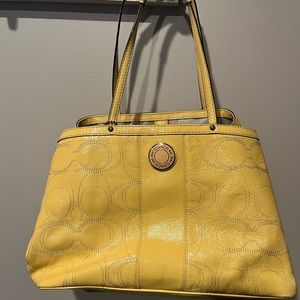 Yellow leather monogrammed Coach purse